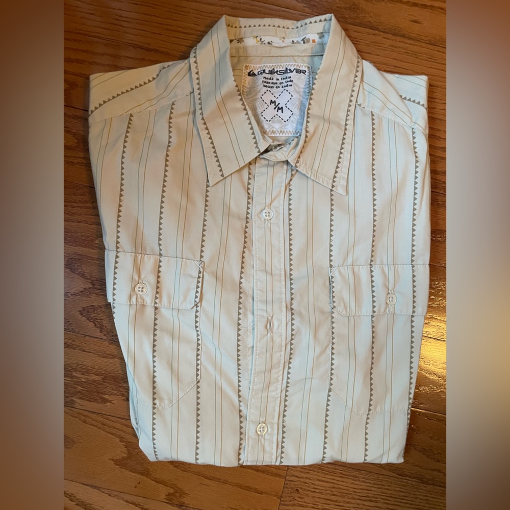 Light tan colored Quicksilver Collared t-shirt